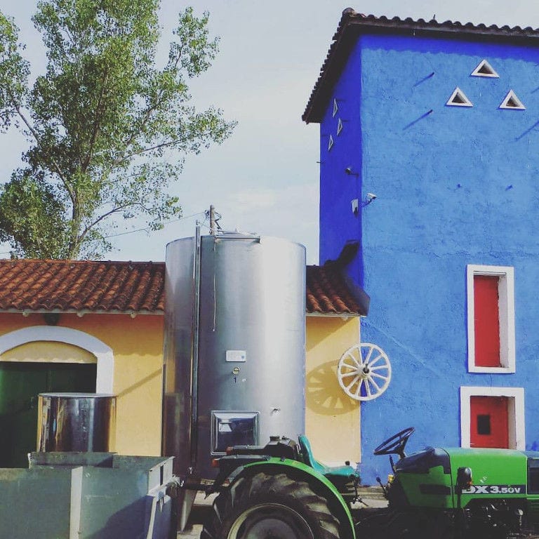 tractor and a tank outside of Kalogris Winery